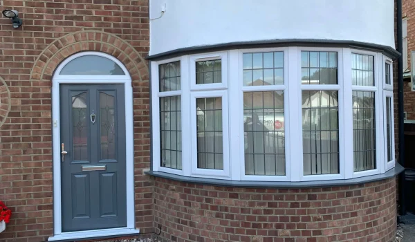 Brown out dated door and window frame painted in grey-after